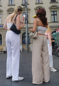 Long blonde braless in a white outfit (many pictures)