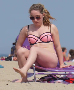 Cute babe in pink and black bikini with a bit of camel toe