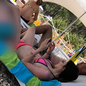 Sexy girl at the pool in pink bikini