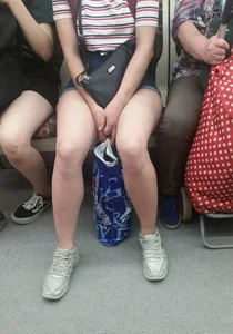 Girl in a Striped T-Shirt and Denim Mini-Shorts Sitting in a Subway Train Creepshot - Hot Legs