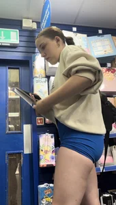 Stunning cheeked up gym girl shopping in blue shorts (OC)