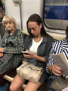 Very hot candid girl sitting in a subway train, closeups of her legs