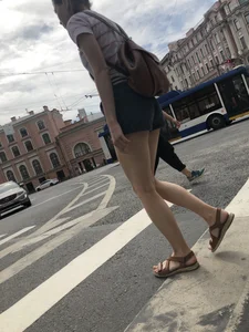 Young Girl in Shorts And Sandals Crossing the Street Gallery