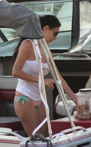 Bikini babe on a boat with a wet see through white shirt showing her tits