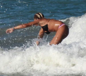 Hot surfer chicks out in the water