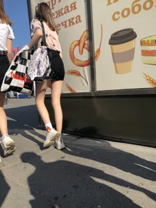 Couple of Skinny Girls in Mini-Skirts And Sneakers Street Photos