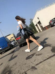 Awesome Candid Girl in a Leather Skirt And Sneakers Walking Down a Street, Then Flashing Her White Panties on the Stairs Creepshots Gallery