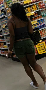 Ebony chick grocery shopping in green shorts