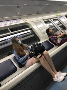 Cute Candid Girl in a Face Mask Sitting in a Subway Train - Thin Sexy Legs