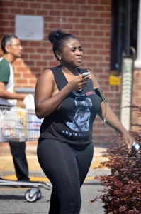 Chubby black lady with big tits and no bra lets it slip