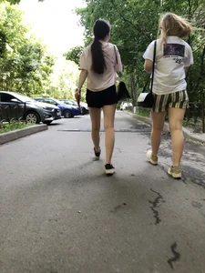 Couple of candid teens walking down the street
