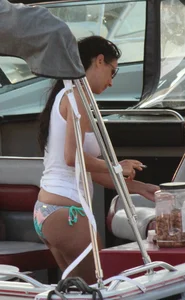 Bikini babe on a boat with a wet see through white shirt showing her tits