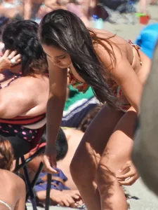 Pretty brunette in a bikini at the beach