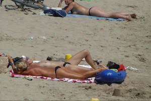 Girls on a nude beach in Sitges, Spain