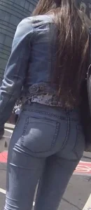 Another girl in tight jeans waiting for the bus