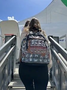 Candid girl in tight pants with a hot ass walking up the stairs to board a plane creepshot