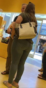 Thick brunette filling out jeans at Lego Store