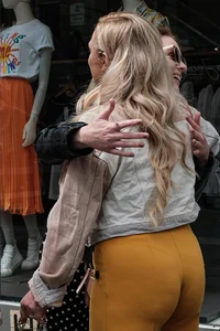 Great big butt in leggings, two milfs hugging