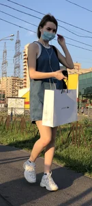 Cute Girl in Denim Dress Legs Closeup