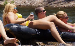 Sexy party girls in bikinis on a lake