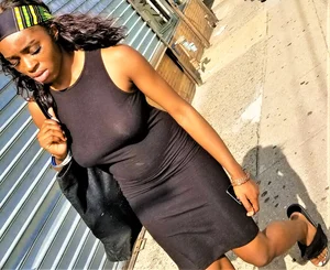 Sexy braless ebony babe in tight skirt with pokies
