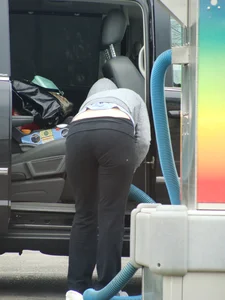 Girls cleaning their cars in jeans and pants