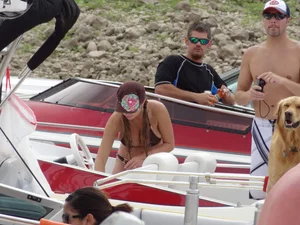 Party girls looking sexy out on boats in bikinis