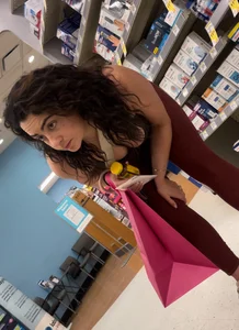 Cute girl in maroon leggings w cleavage