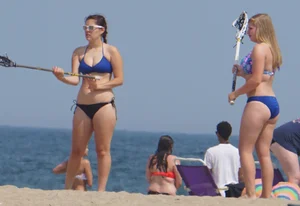 3 girls on the beach in bikinis with big boobs, one brunette and two blondes