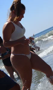 Big booty teen at the beach in a white bikini