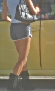 Skinny babe going to her car in little cotton shorts