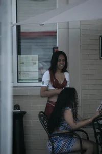 Two sexy Tilted Kilt employees showing cleavage and cheeks