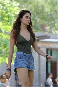 Gymnast or yoga girl in the park in shorts and no bra and even showing some pussy
