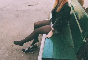 Redhead Sitting on the Bench in Black Pantyhose with Shoes Taken Off Candid