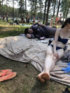 Skinny Pale Candid Girl in Swimsuit Sitting on Grass at the Lake Beach Creepshot