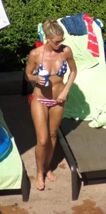 Blonde babe at the pool with sexy body in USA bikini