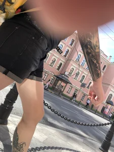 Amazing cute candid food delivery girl with lots of tattoos crossing the street