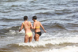 Frankie Bridge nip slips in a bikini on the beach