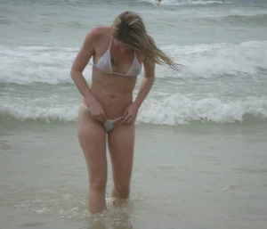 Amazing beach girl in a micro bikini