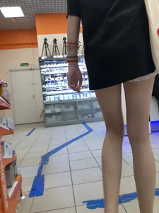 Tall Skinny Girl in Shorts and Sneakers With Long Thin Legs at a Store Creepshots Collection