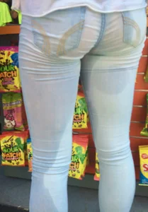 Girl in wet jeans making them semi see through