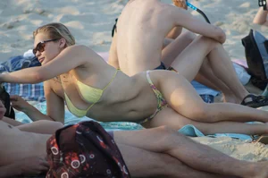 Girl in Sunglasses with Hot Stomach Lying on the Sand Beach Creepshots