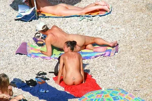 Ula FKK Sexy brunette on a nude beach topless, bottomless and with blue thong