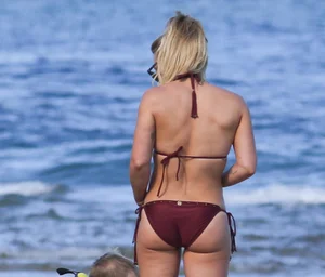 Hilary Duff in maroon bikini on the beach with a big booty