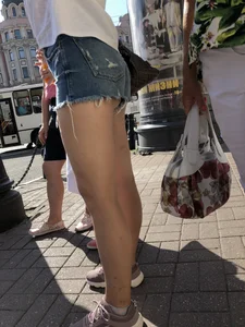 Awesome ass in fringed denim shorts and perfect legs, candid girl's street photos