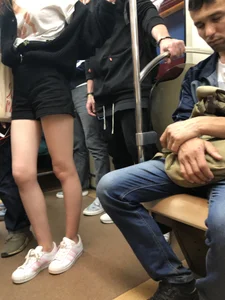 Girl in Shorts with Hot Skinny Legs in a Subway Train Candid