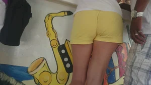 Milf in yellow shorts with vpl and a wedgie