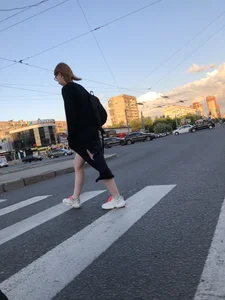 Teen wearing black dress which becomes transparent