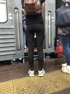 Teen Girl in Tights And Sneakers Standing on the Train Platform VPL Photos