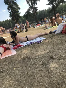 Pale Girl in Swimsuit Lying on a Lake Beach With Her Friends Creepshots Gallery